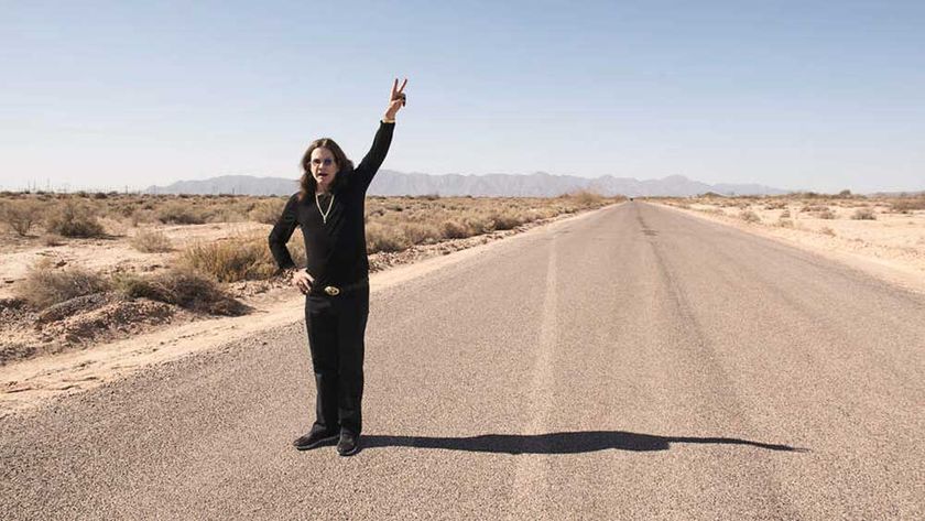 Ozzy Osbourne standing on a desert road