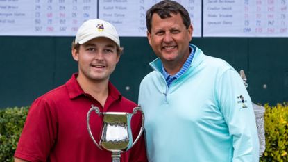 South Carolina golfer Nathan Franks poses with a trophy
