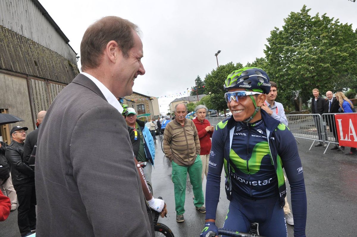 Christian Prudhomme greets Nairo Quintana, a Tour de France favourite, on the start line