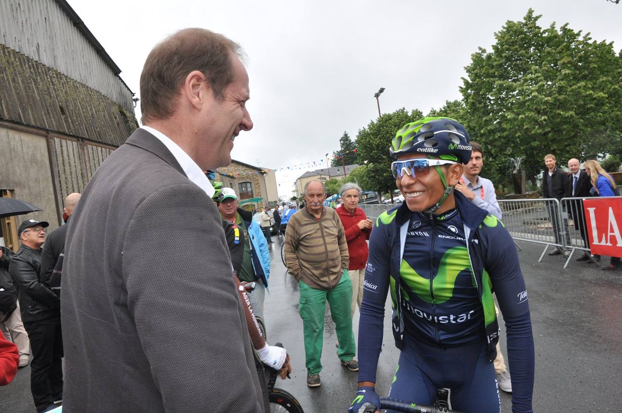Christian Prudhomme greets Nairo Quintana, a Tour de France favourite, on the start line