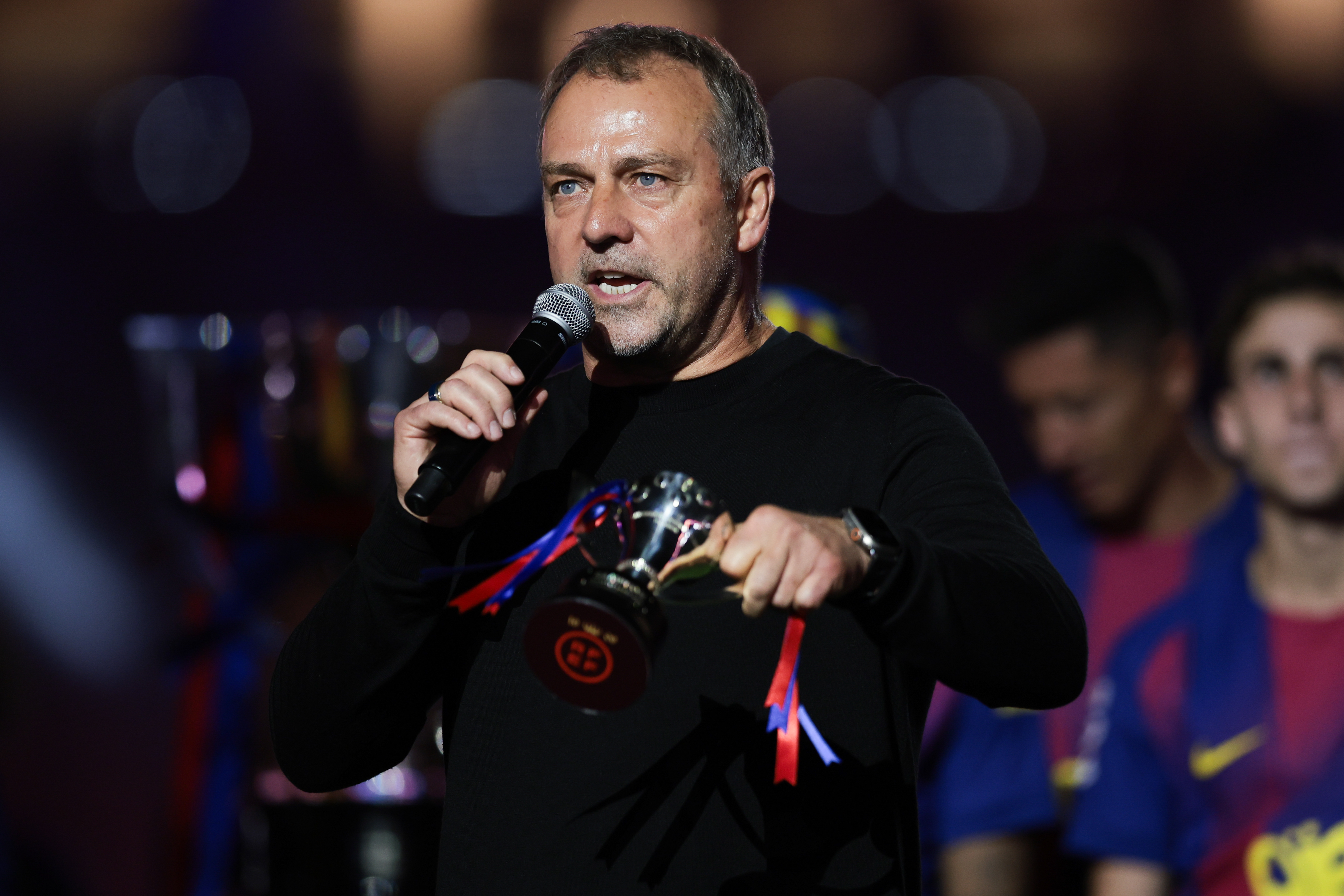 BARCELONA, SPAIN - MAY 10: Hansi Flick, Head Coach of FC Barcelona, speaks to the fans as players of FC Barcelona (Photo by Eric Alonso/Getty Images)