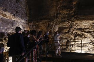 A group of reporters and guests enter the Hypogea area of the Colosseum ahead of a press conference to present the end of second stage of the monument's restorations, in Rome, Italy, on June 25, 2021.
