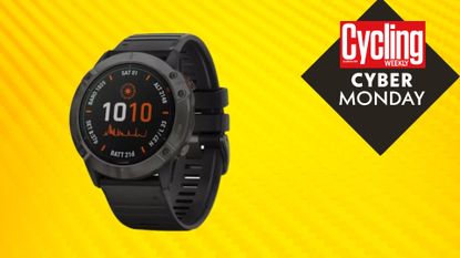 Image shows the Garmin Fenix 6 smartwatch on a Cyber Monday yellow background