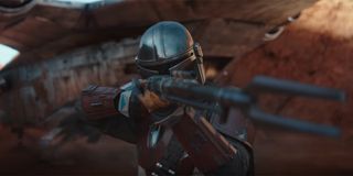 The Mandalorian aiming his rifle