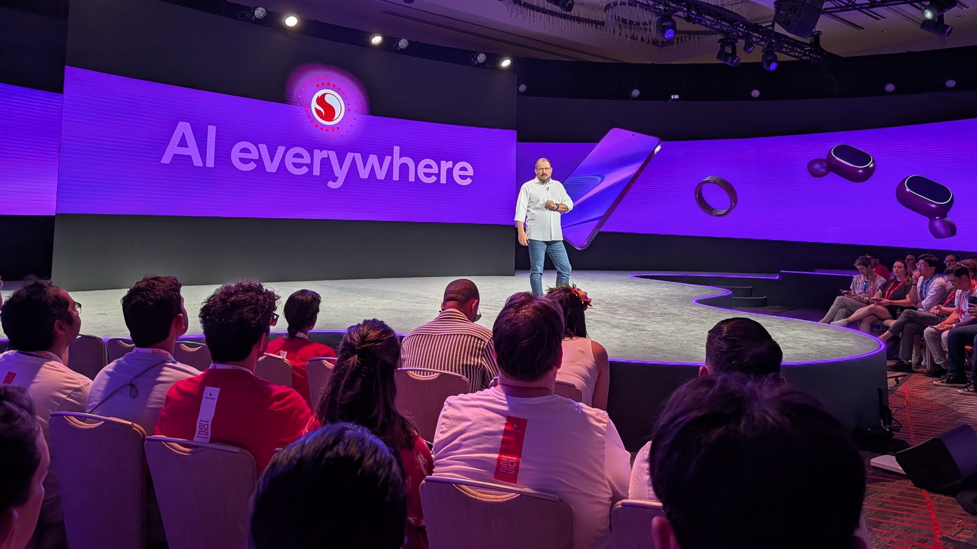 Cristiano Amon of Qualcomm at Snapdragon Summit in front of AI everywhere sign