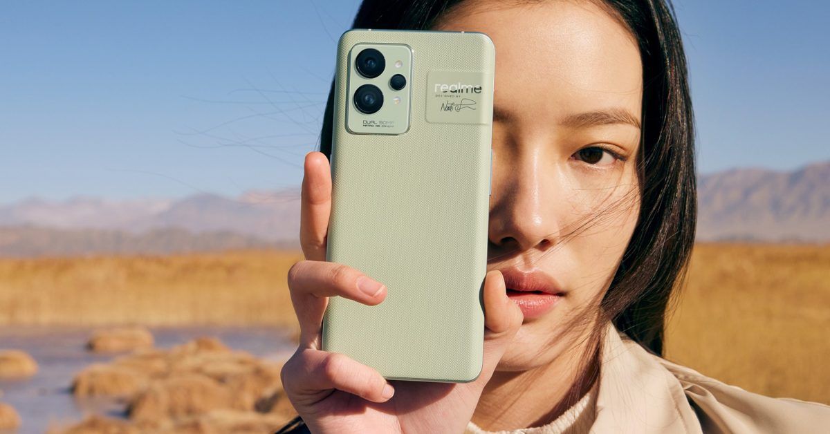 Realme GT 2 Pro held y woman near mountains