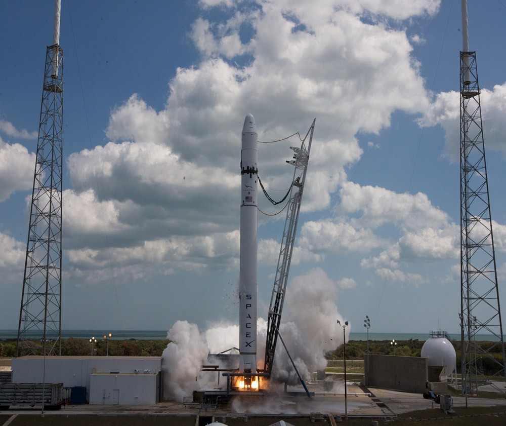 Falcon 9 rocket successfully test fires nine engine first stage.