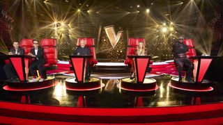 McFly duo Tom and Danny, Tom Jones, LeAnn Rimes, and will.i.am pose in their red chairs in The Voice UK 2024