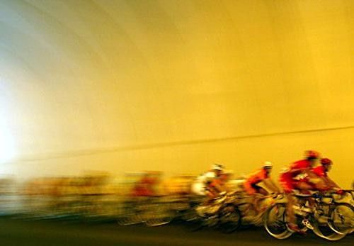 The peloton passing through a tunnel during stage 8