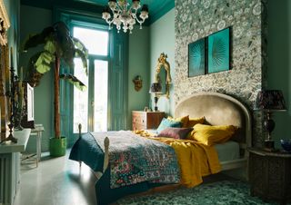 Bedroom with light green walls and darker green painted woodwork
