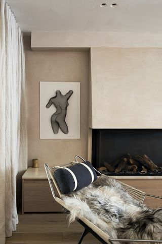 Sheepskin covered lounge chair with fireplace