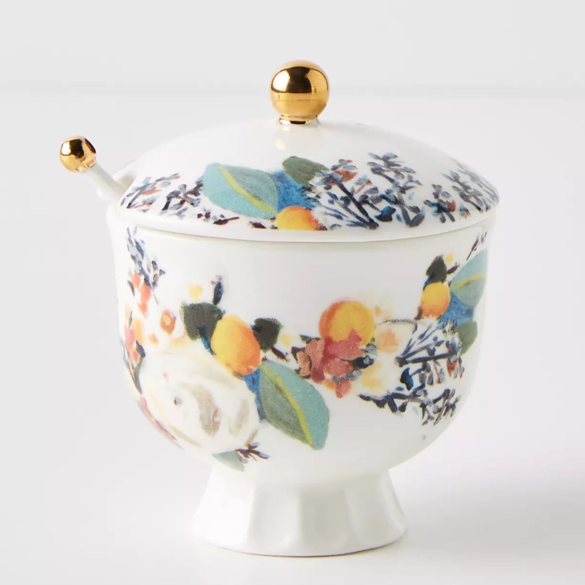 White sugar bowl with floral print and gold accents