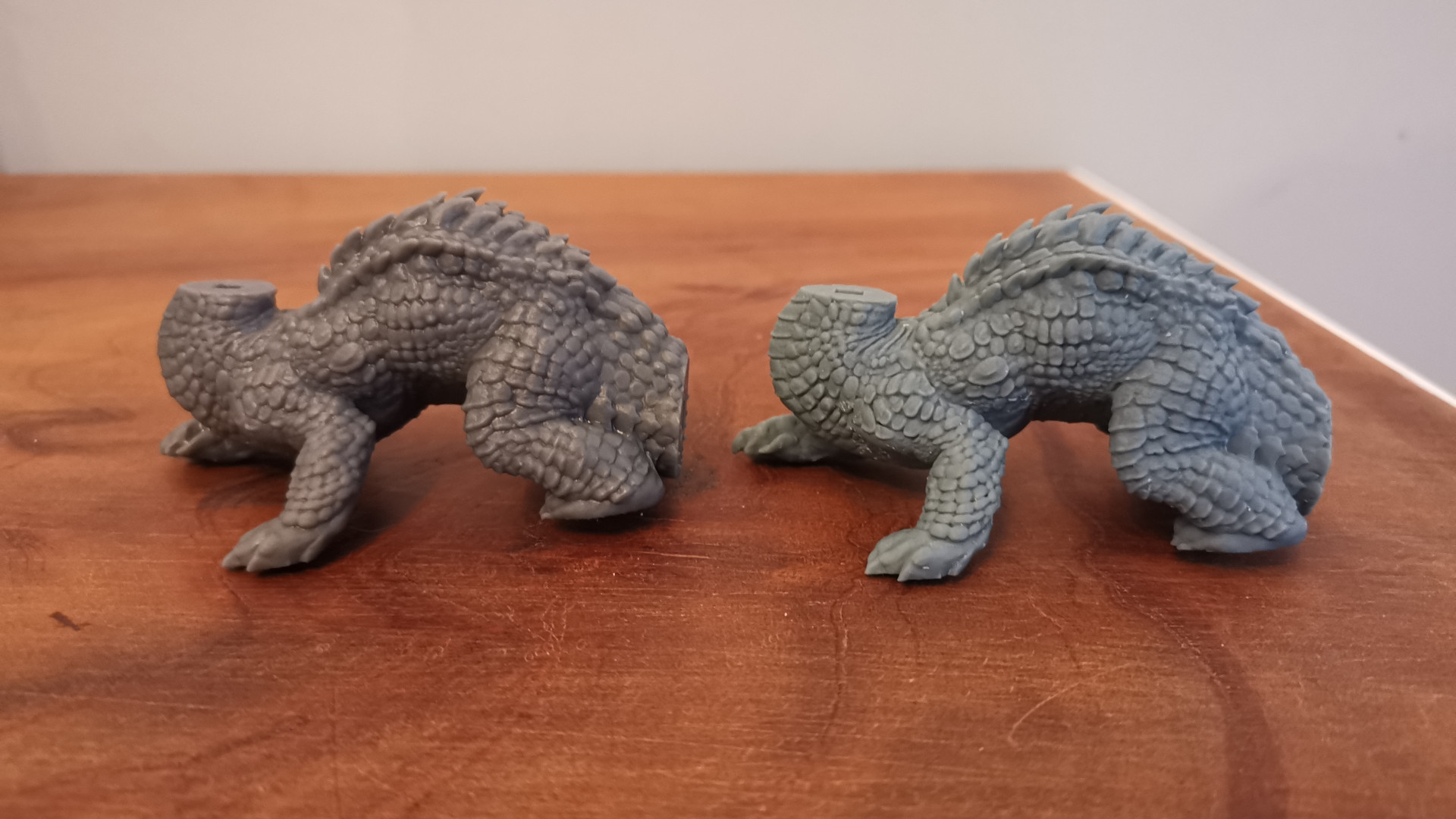 A comparison between a dragon body printed on the Formlabs Form 3 and the Phrozen Sonic Mini 8K