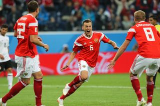 Denis Cheryshev (centre) celebrates with his Russia team-mates after scoring against Egypt at the 2018 World Cup.