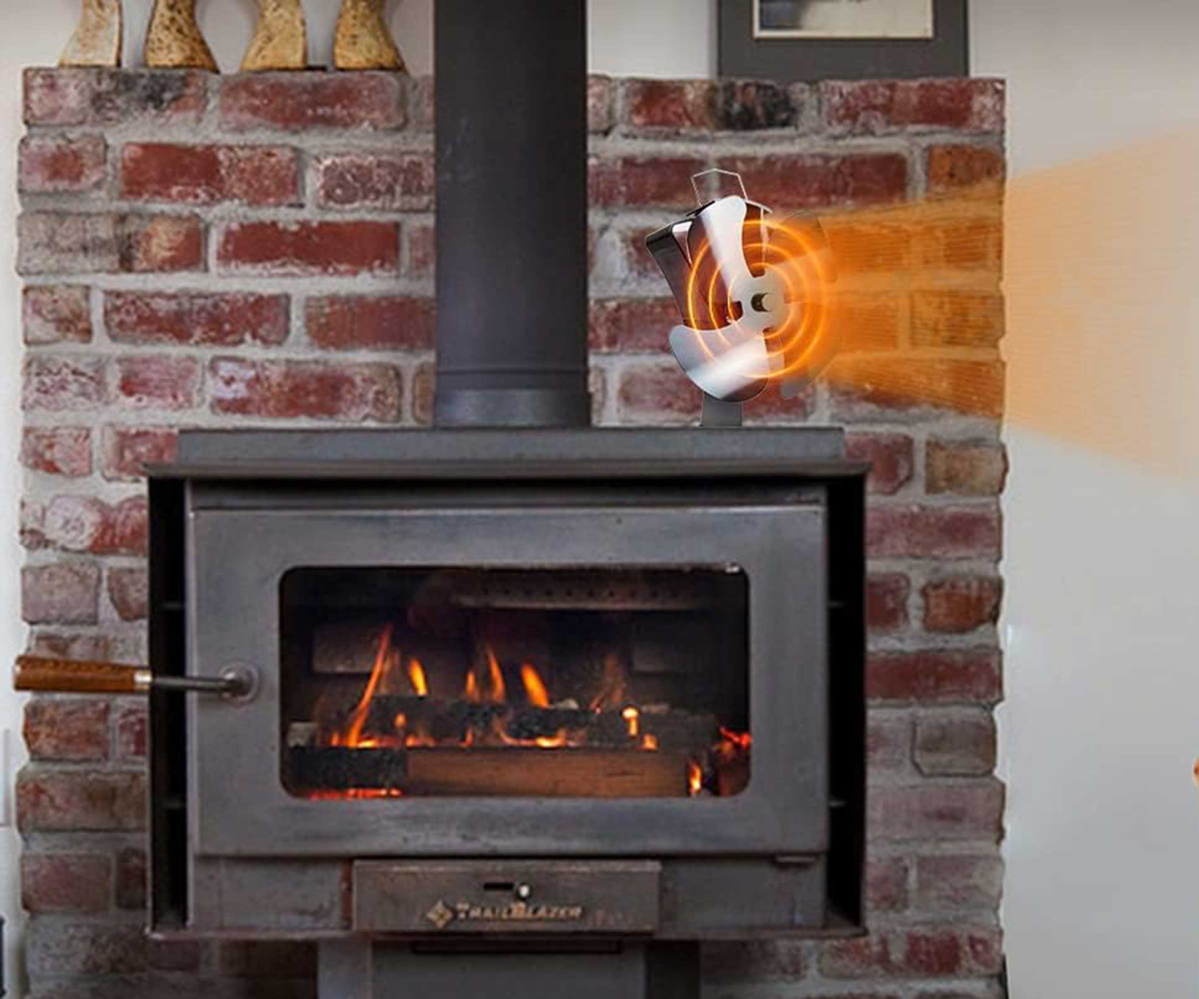 Tomersun stove fan on top of a wide log burning stove