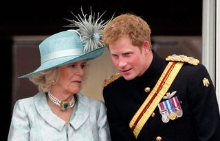 Camilla, Duchess of Cornwall and Prince Harry stand on the balcony of Buckingham Palace