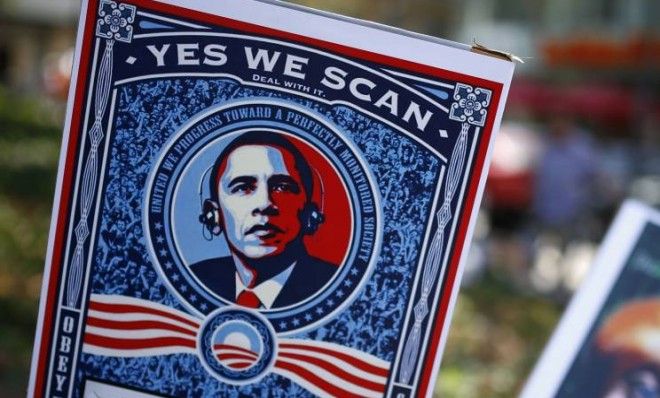 Placards showing President Barack Obama and German Chancellor Angela Merkel at a July demonstration in Germany against the NSA.