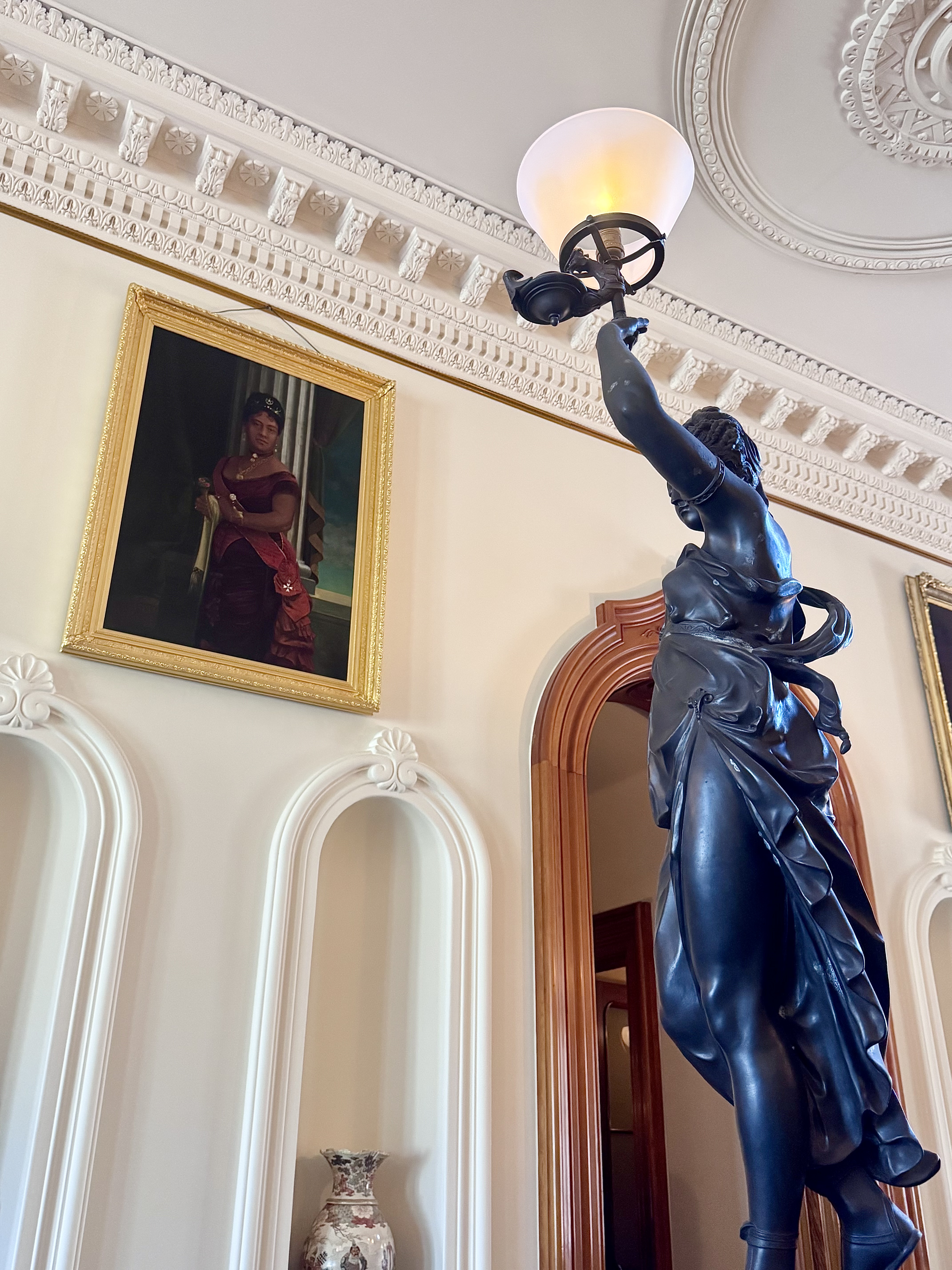 A statue and painting in Hawaii's Iolani Palace