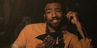 Donald Glover playing cards as Lando Calrissian