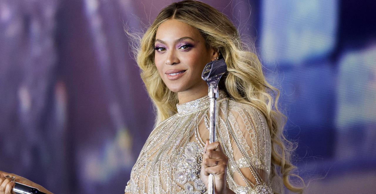 beyonce onstage wearing a glittering dress