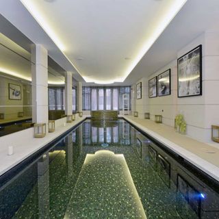 spa with swimming pool and mosaic tiling