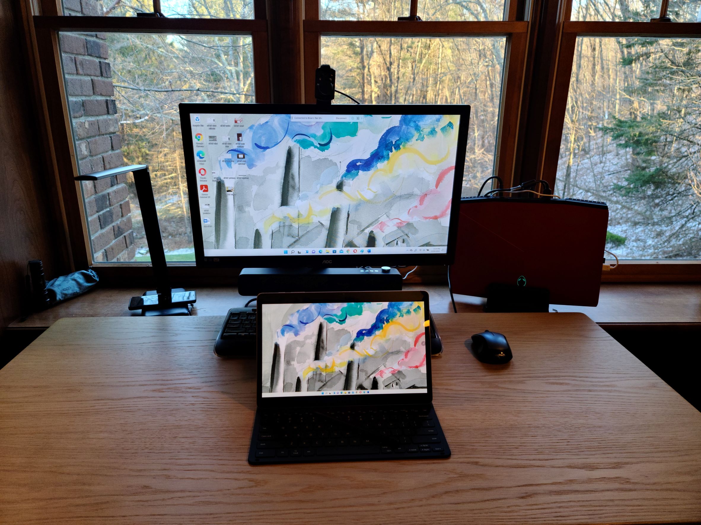 Samsung Galaxy Tab S8 Plus on a desk showing PC monitor being mirrored
