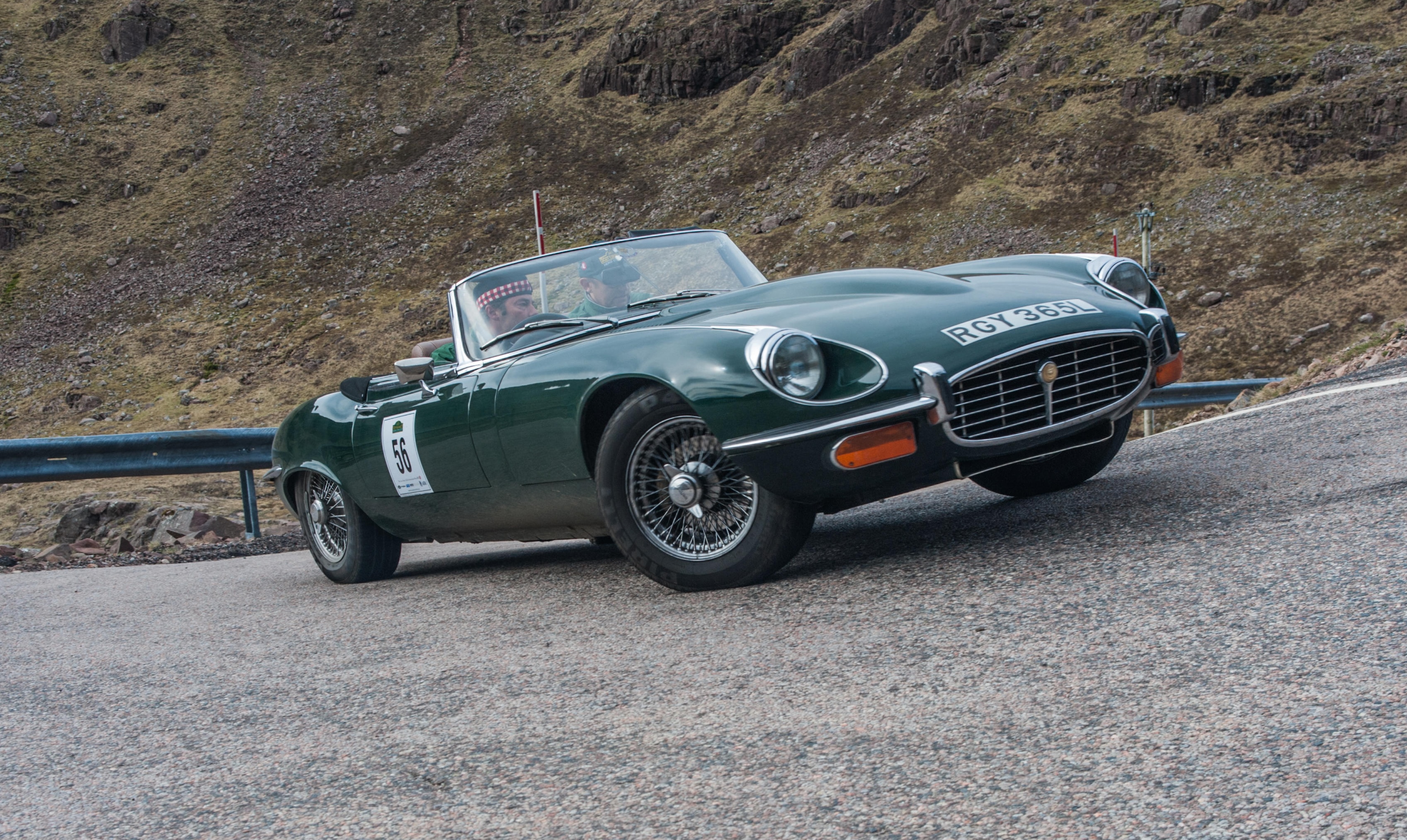 A 1973 jaguar E-Type Series 3 on the Bealach na Ba in Applecross Scotland
