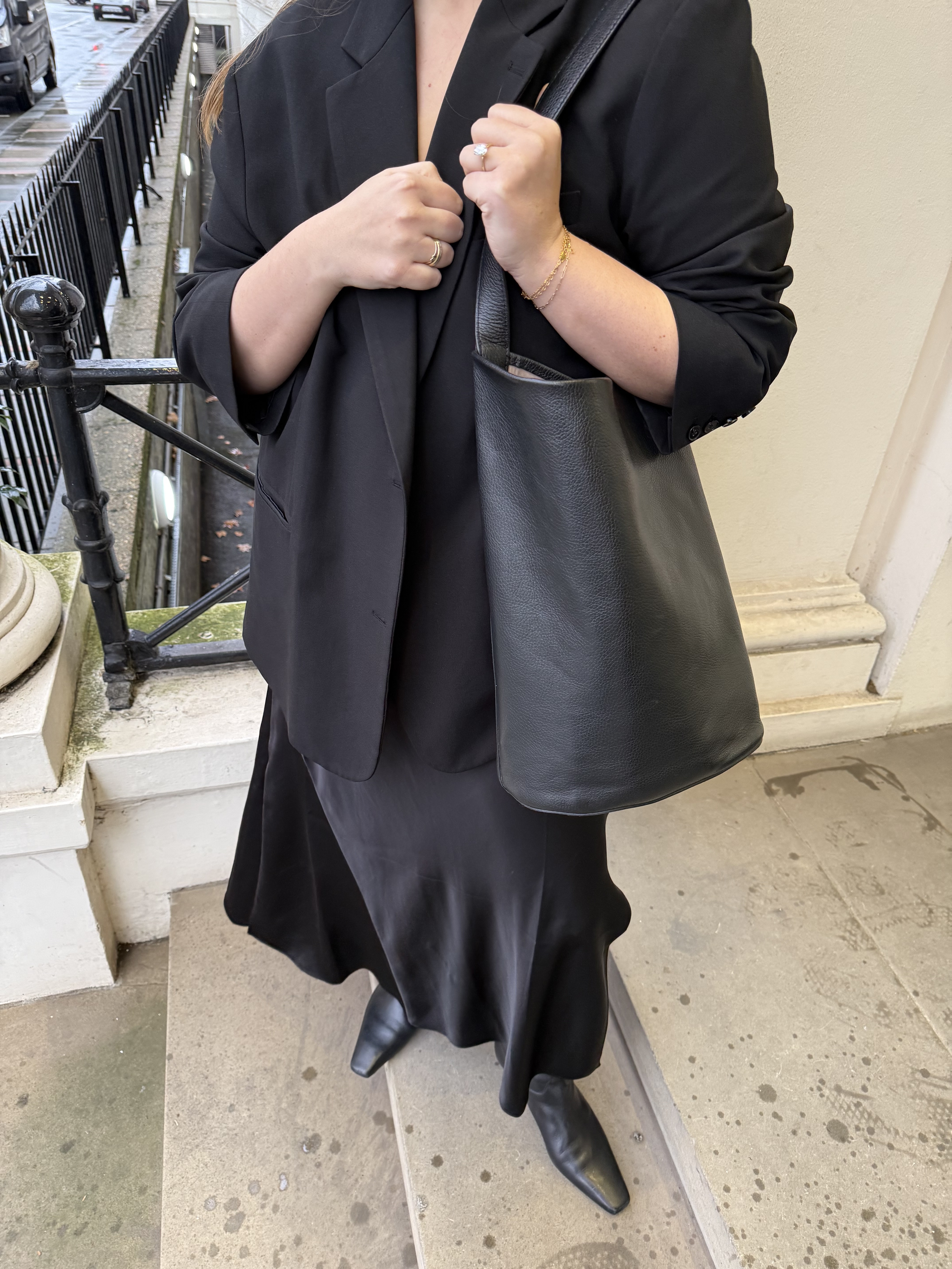 An image ofBest Knockoff Luxury Clothing
 UK Managing Editor, Poppy Nash, reviewing the COS bucket bag.