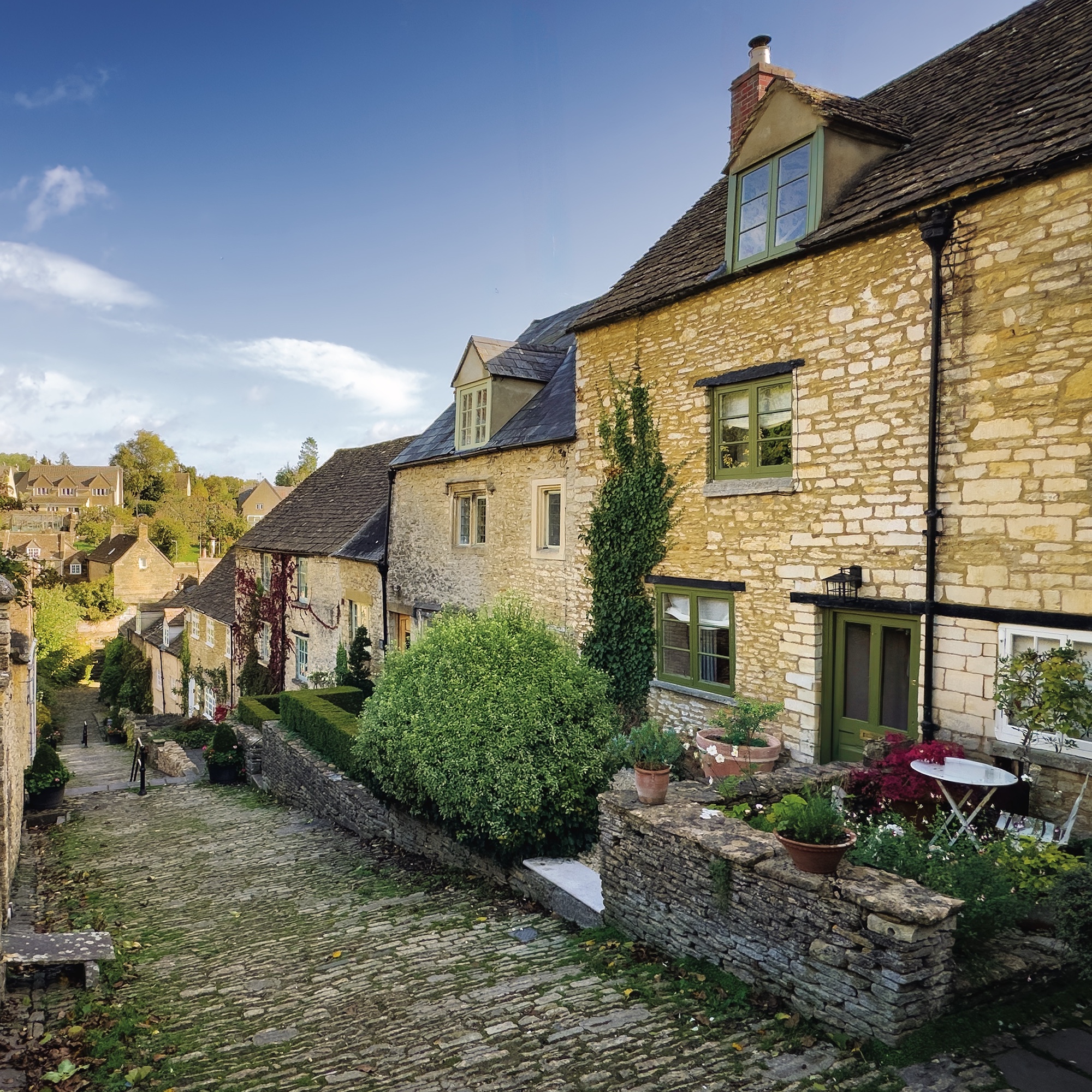 exterior of stone cottage on cobbled lane