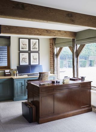 Wooden desks, exposed wooden beam on ceiling and window