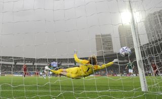 Ireland’s goalkeeper Caoimhin Kelleher dives but fails to save the goal from Armenia’s Eduard Spertsyan