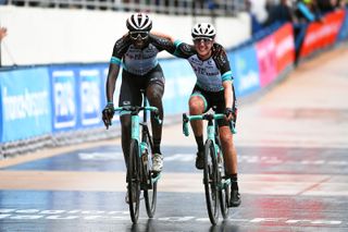 Jessica Allen (right) finishing Paris-Roubaix Femmes with her BikeExchange teammate Teniel Campbell