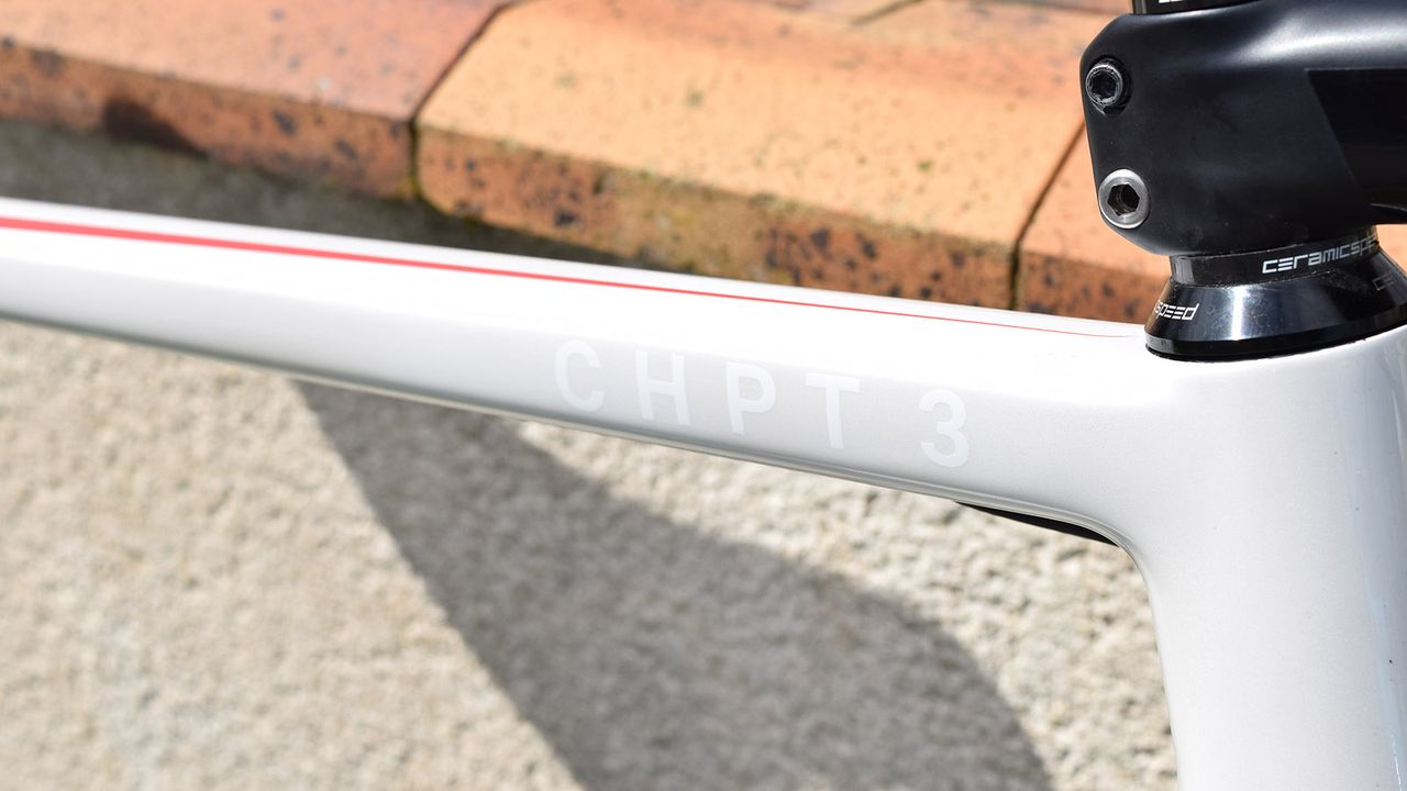 White decals on the light grey base coat have CHPT 3 at the head of the top tube