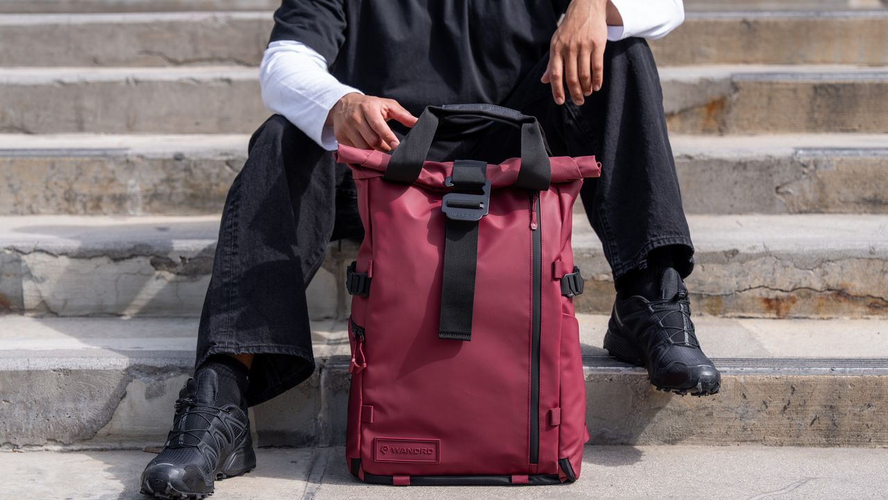 The Wandrd Prvke camera backpack in front of a person on stairs