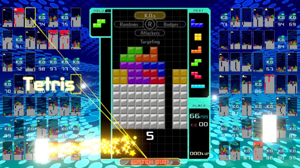 A screenshot from tetris 99, showing the player completing a Tetris and using it to attack two other players