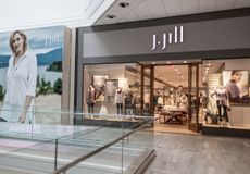 A J. Jill store and poster in a shopping centre