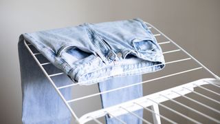 pair of jeans on a drying rack