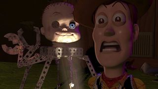 Woody runs from Spider, the friendly mechano baby head toy with pincers