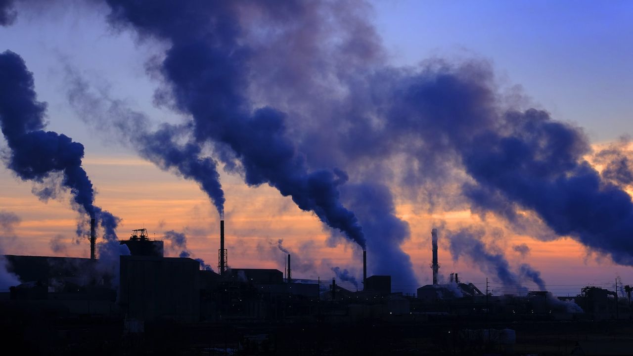 Factories polluting into sky.