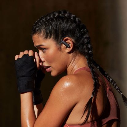 model wearing beats powerbeats headphones