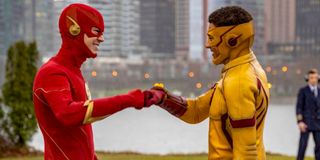 Grant Gustin and Keiynan Lonsdale as Flash and Kid Flash fist bumping in CW's The Flash