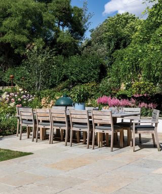 limestone tiled patio with dining table and chairs