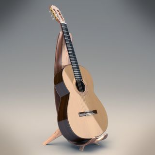 A classic guitar propped up on a stand