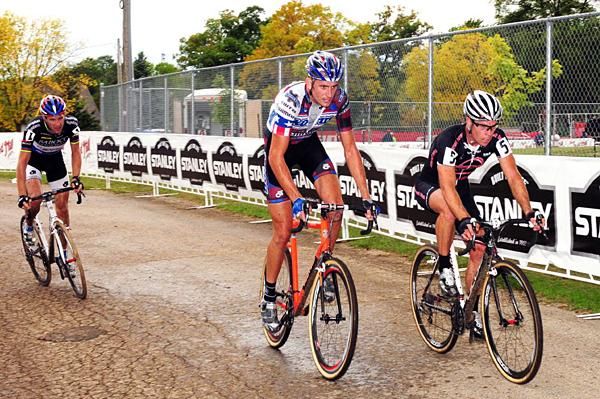 Vervecken, Trebon and Page on the pavement with one lap to go.