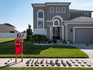 All-About-Photo.com The Mind’s Eye Awards 2020 Second Place Winner: Avery Skipalis (33), outside of her house, posing together with all the firearms she owns, Tampa, Florida (Gabriele Galimberti) – www.all-about-photo.com via photopublicity.com 