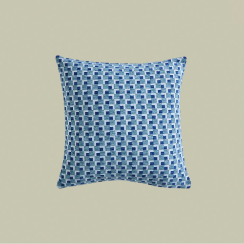 A blue geometric cushion