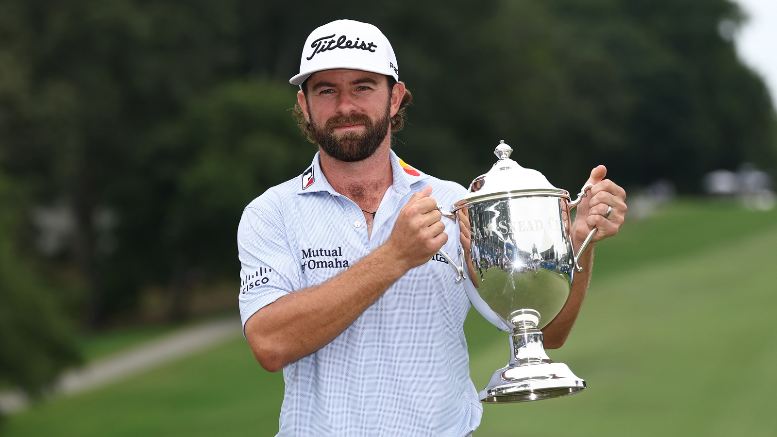 Cameron Young holds the Wyndham Championship trophy