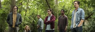 Adult Losers Club standing in the woods in IT CHapter 2