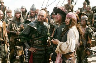 Sao Feng (Chow Yun-Fat) negotiates with Captain Barbossa (Rush) and Captain Jack Sparrow (Depp).