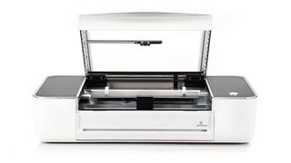 A press photo of the Glowforge Pro with its lid open.